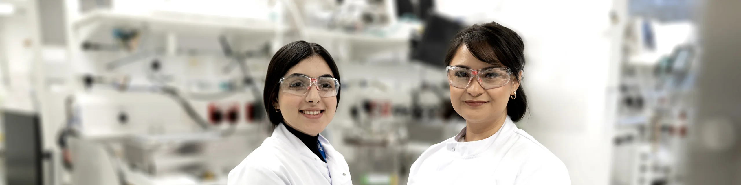 two female lab workers in a sterile lab